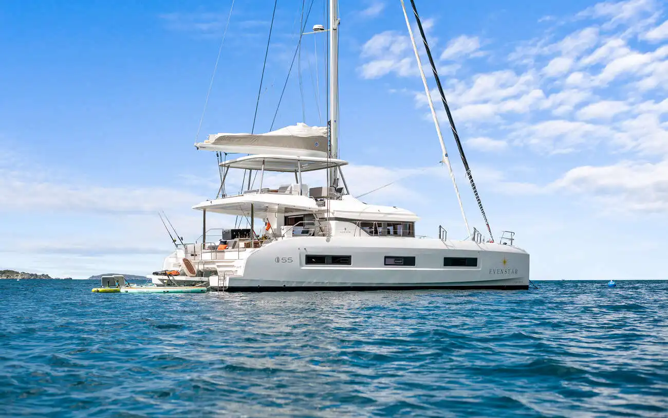 Luxury sailing catamaran on clear Caribbean water during a BVI catamaran charter for groups