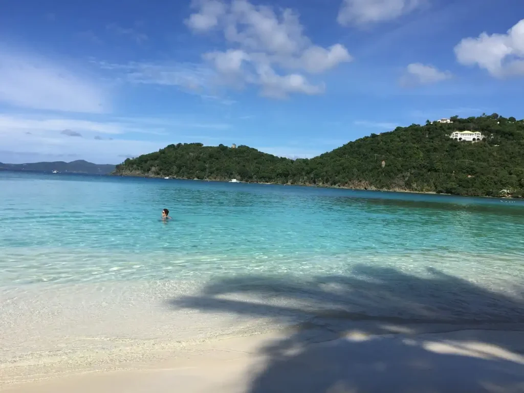 Swimmer in calm turquoise water during a St. John yacht charter itinerary